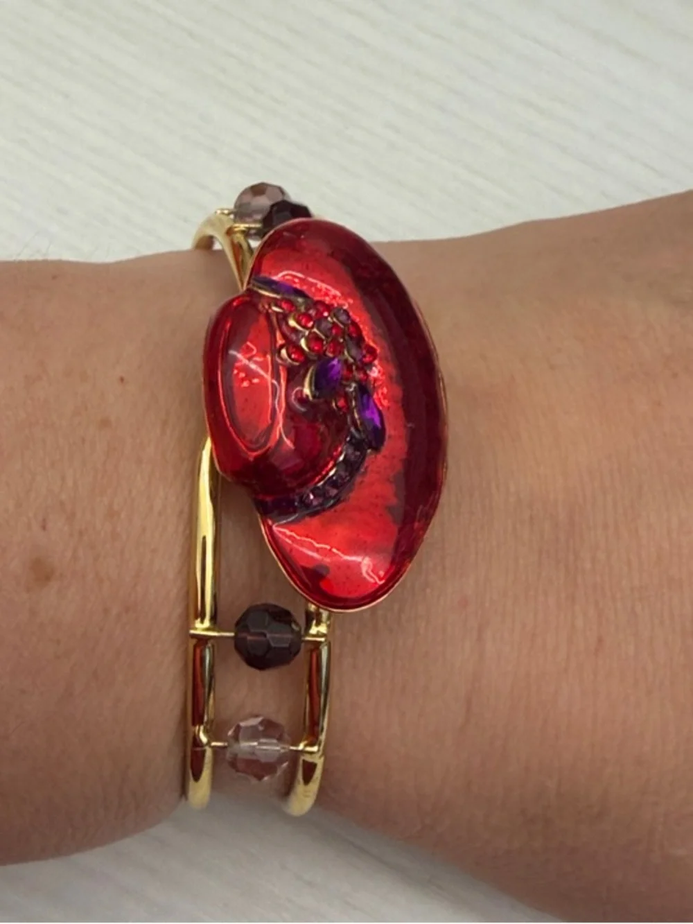 Gold Bangle Bracelet with Red Floral Accent